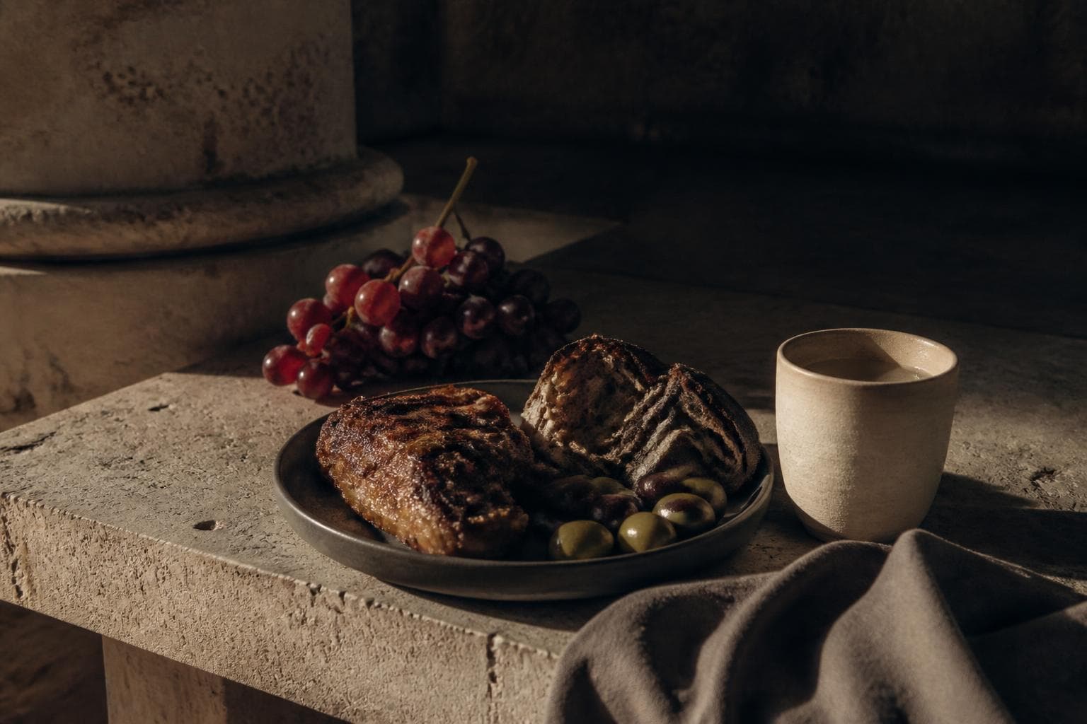 Simple Roman meal on a travertine stone table